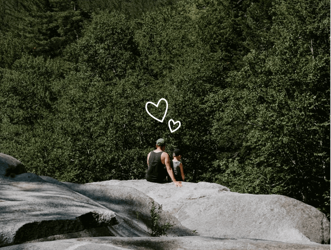 couple enjoying nature and looking at the forest