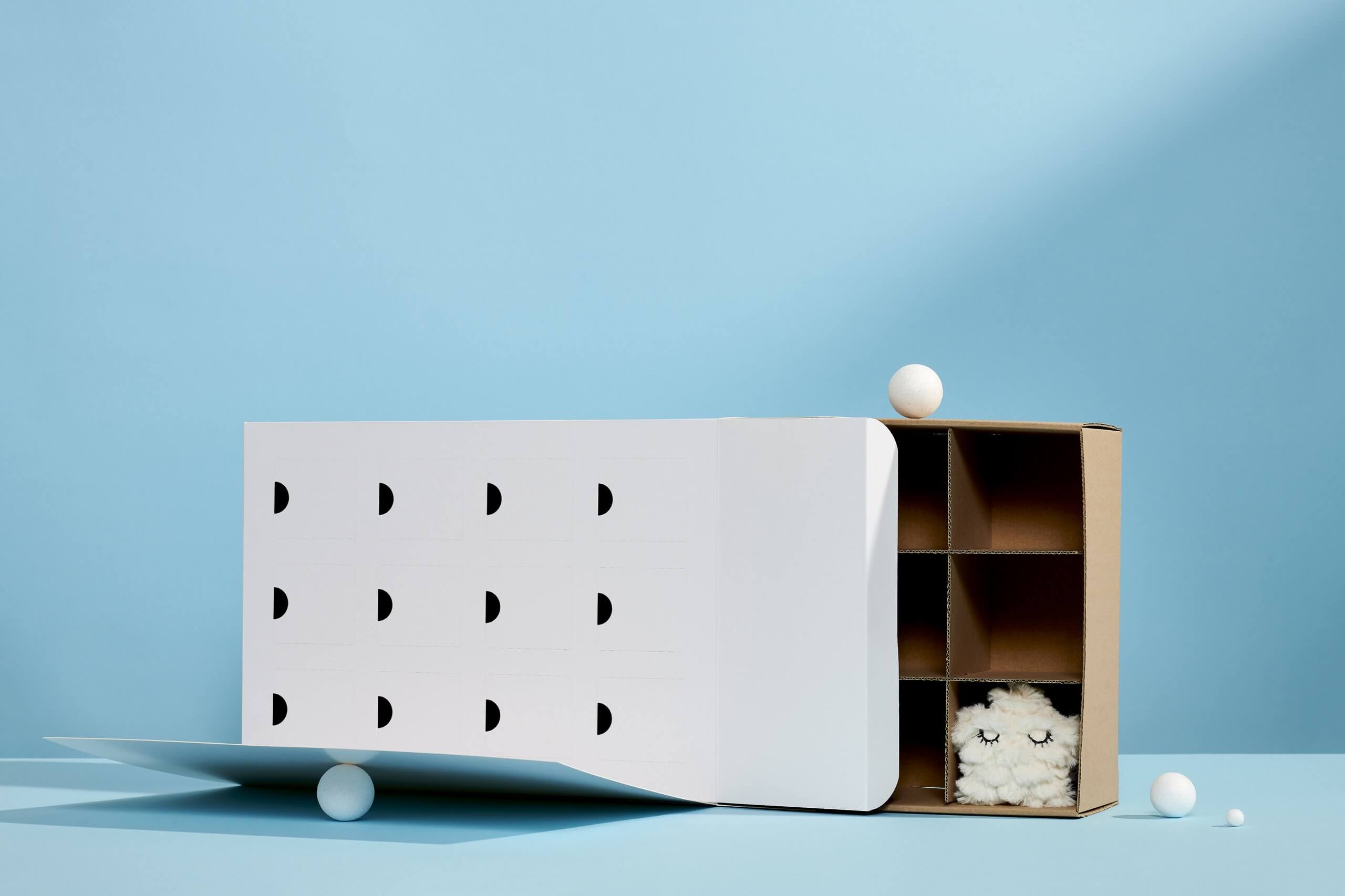 Cardboard advent calendar box with gifts